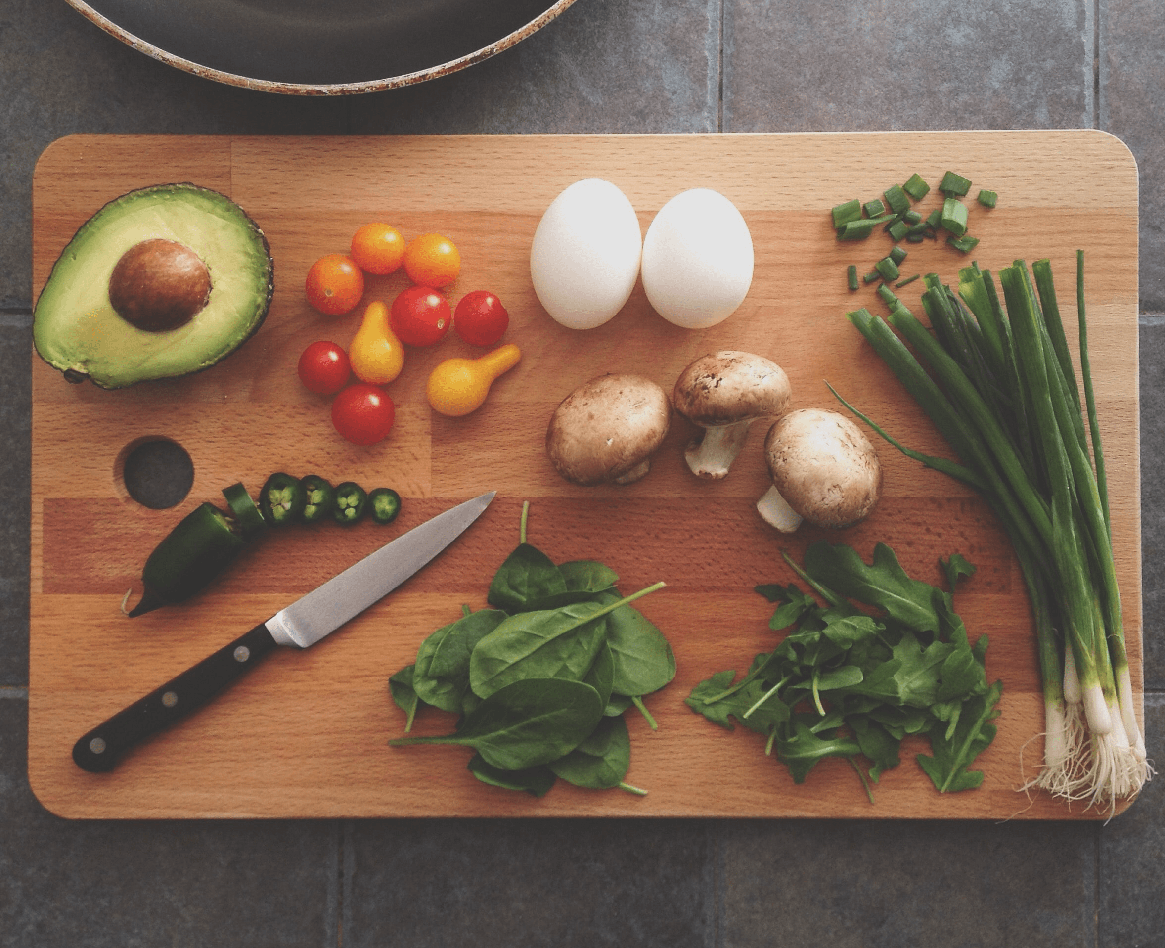 A chopping board with prepared food